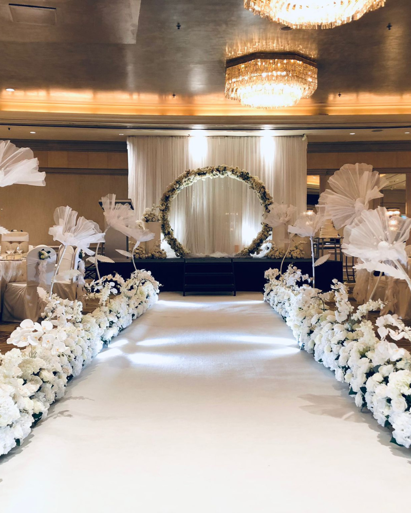 Wedding aisle decor and venue styling with flowers