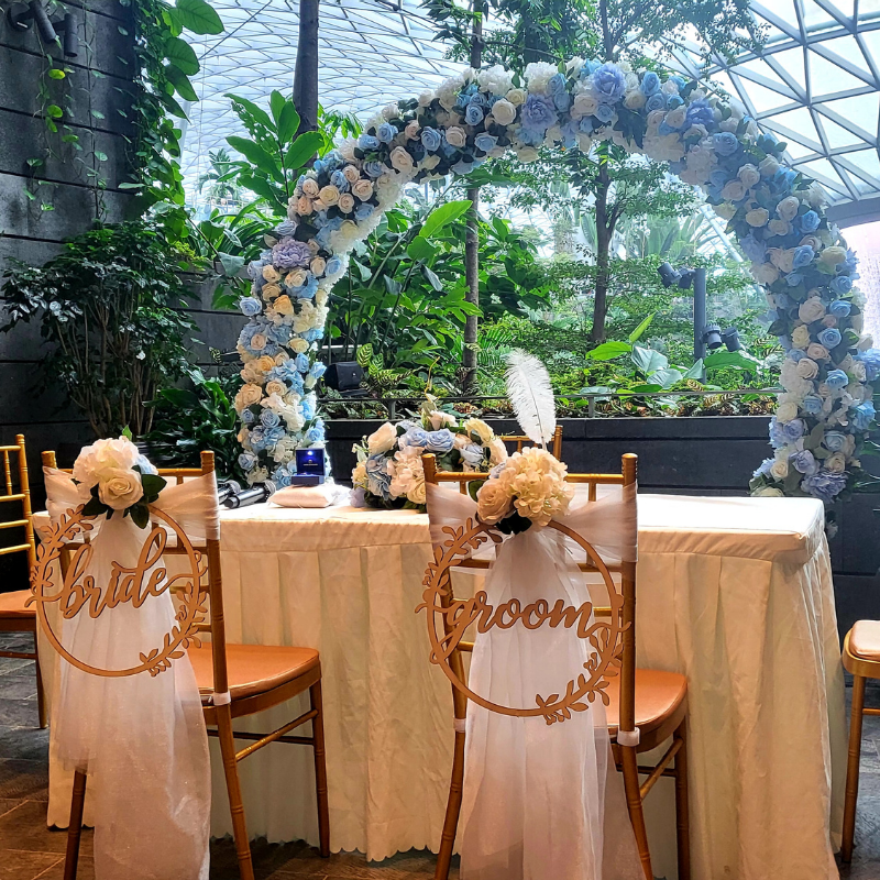 Garden solemnisation setup with floral arch