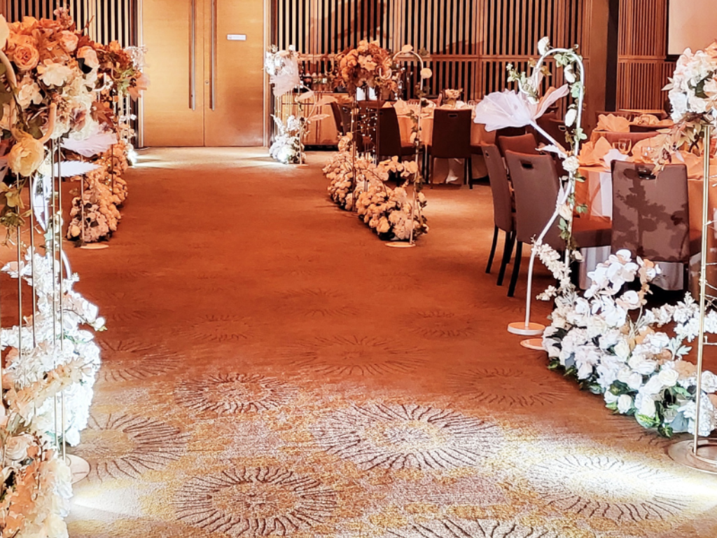 Elegant wedding aisle decor with premium artificial floral arrangements, floral stands and ambient lighting by Zeaflora